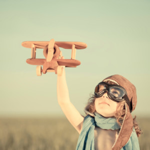kid with toy airplane